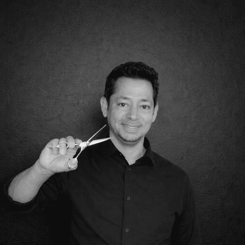 Portrait of Luis Solano, a professional stylist at Salon CG, showcasing their expertise and style.