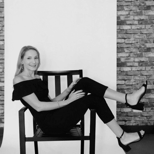Portrait of Ashley Hall, a professional stylist at Salon CG, showcasing their expertise and style.