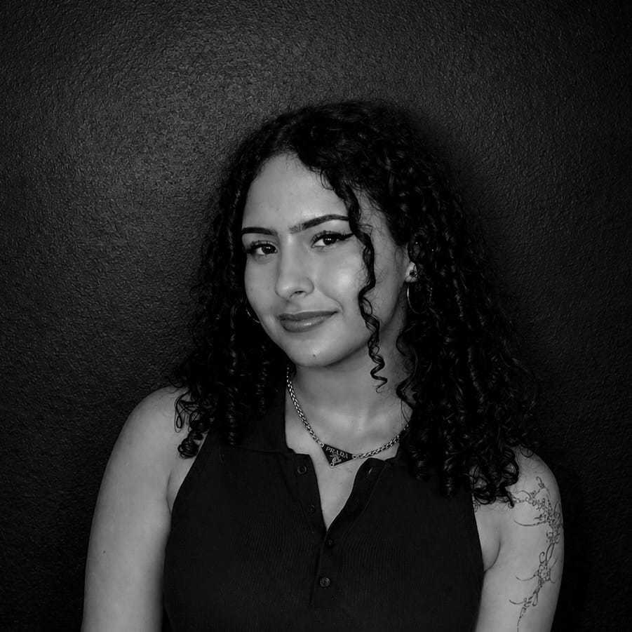 Portrait of Crystal Andujar, a professional stylist at Salon CG, showcasing their expertise and style.