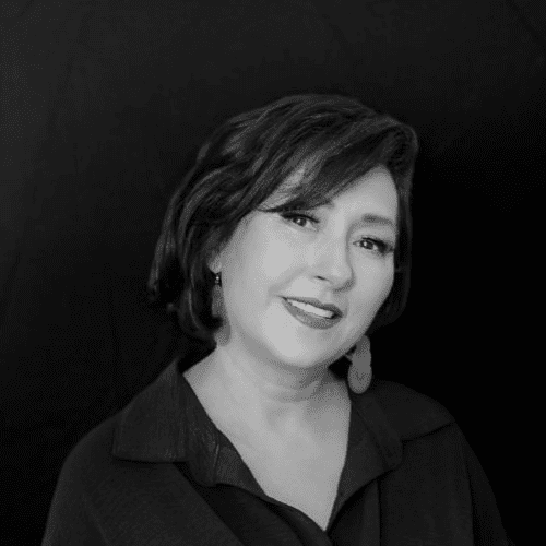 Portrait of Gracie Villa, a professional stylist at Salon CG, showcasing their expertise and style.