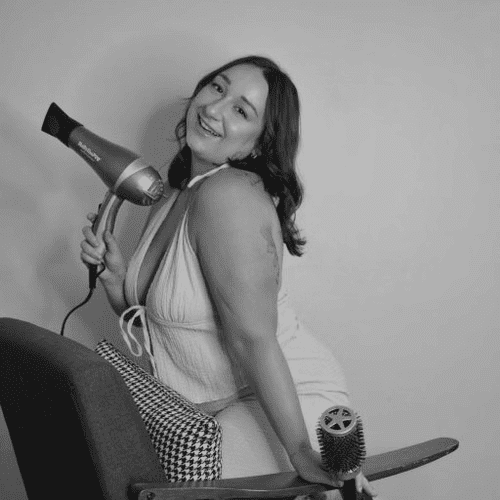 Portrait of Jana Pisani, a professional stylist at Salon CG, showcasing their expertise and style.